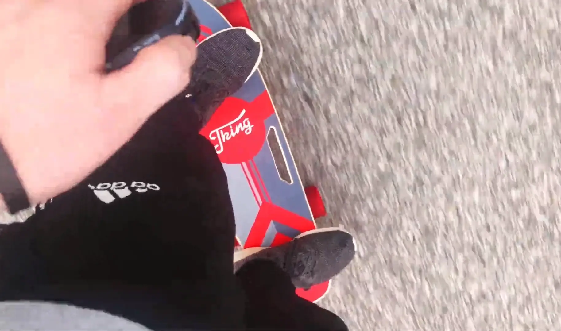 Riding on a Caroma Electric Skateboard with remote