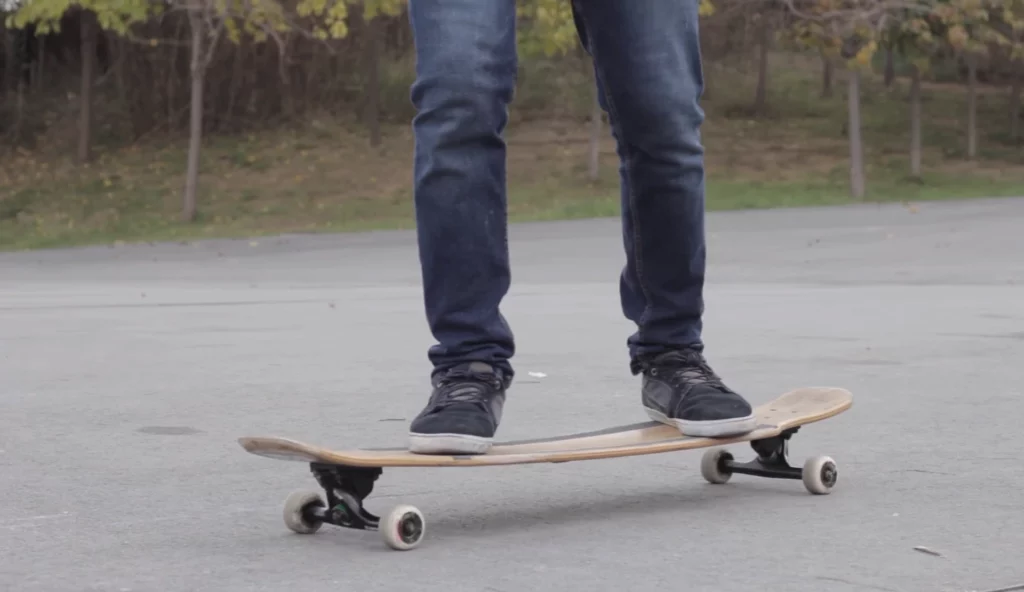 a person holding balance while longboarding