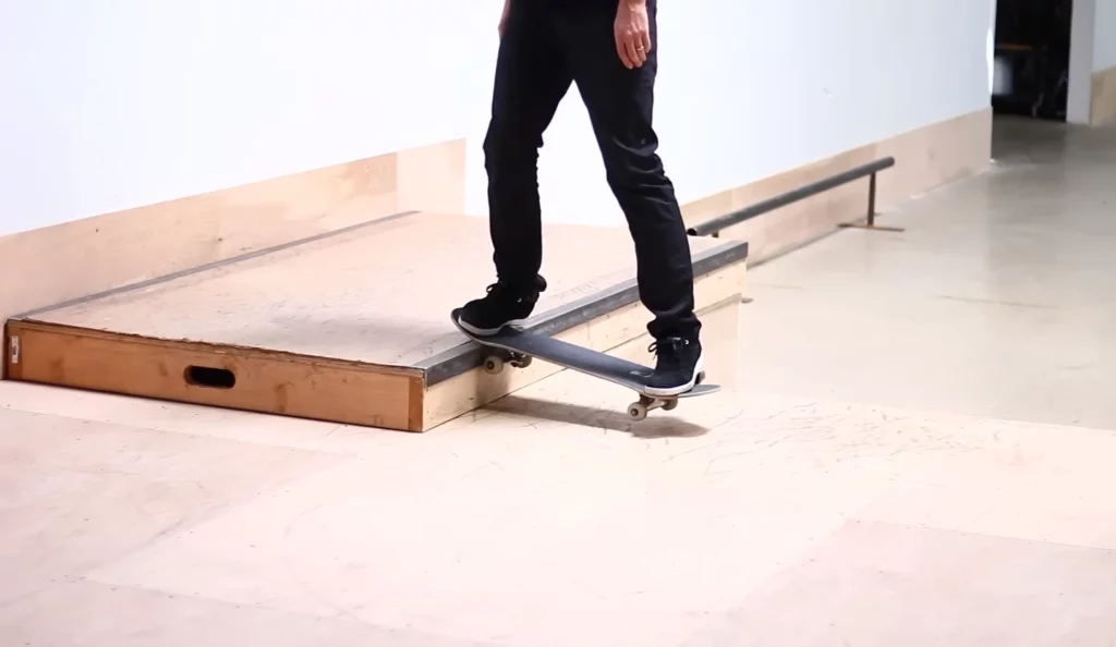 A person lifting skateboard