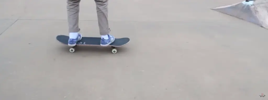 a man is riding on a scate board 